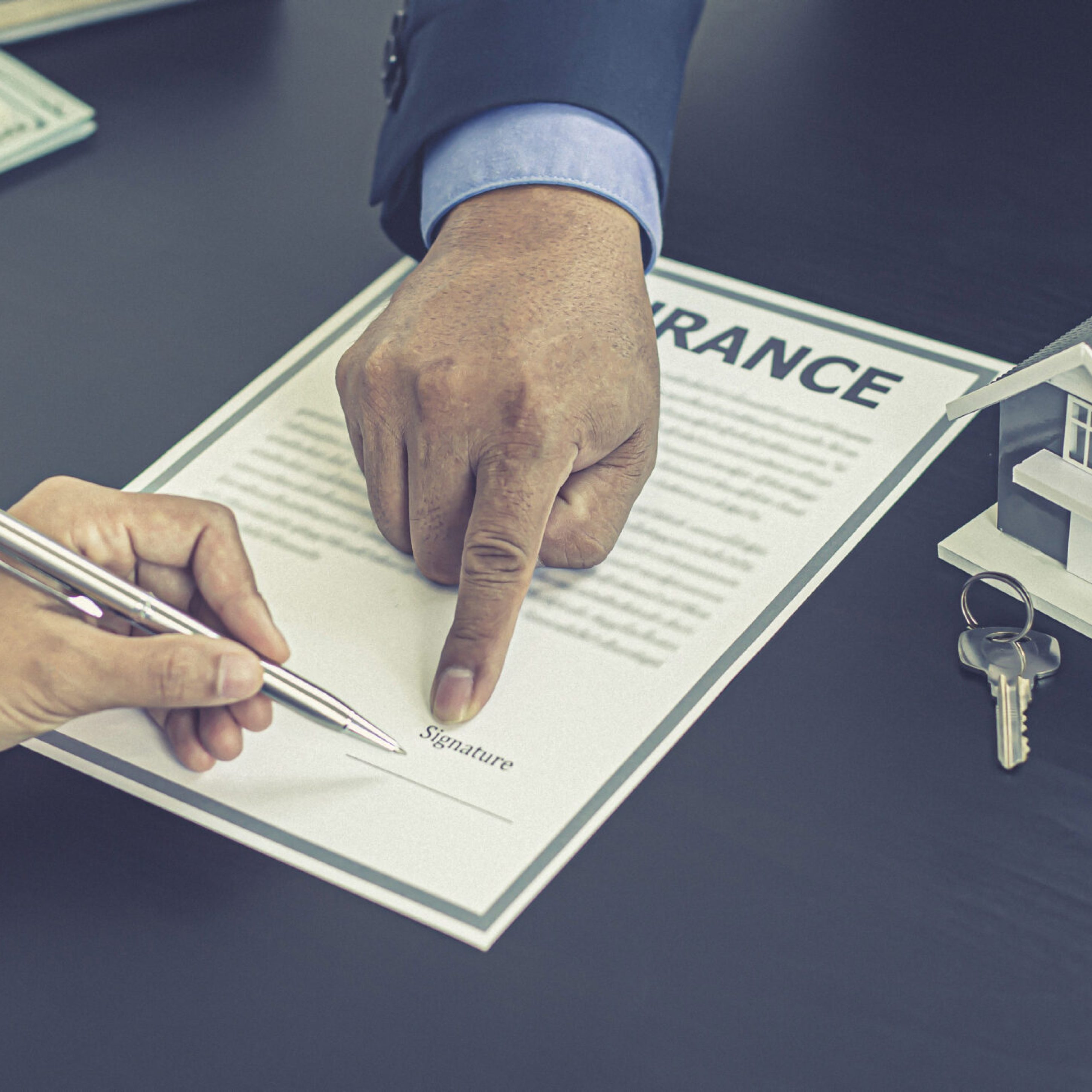 Real estate agent or sales manager has proposed terms and conditions to customers who sign house purchase agreements with insurance, Agreement to sign the purchase contract concept.